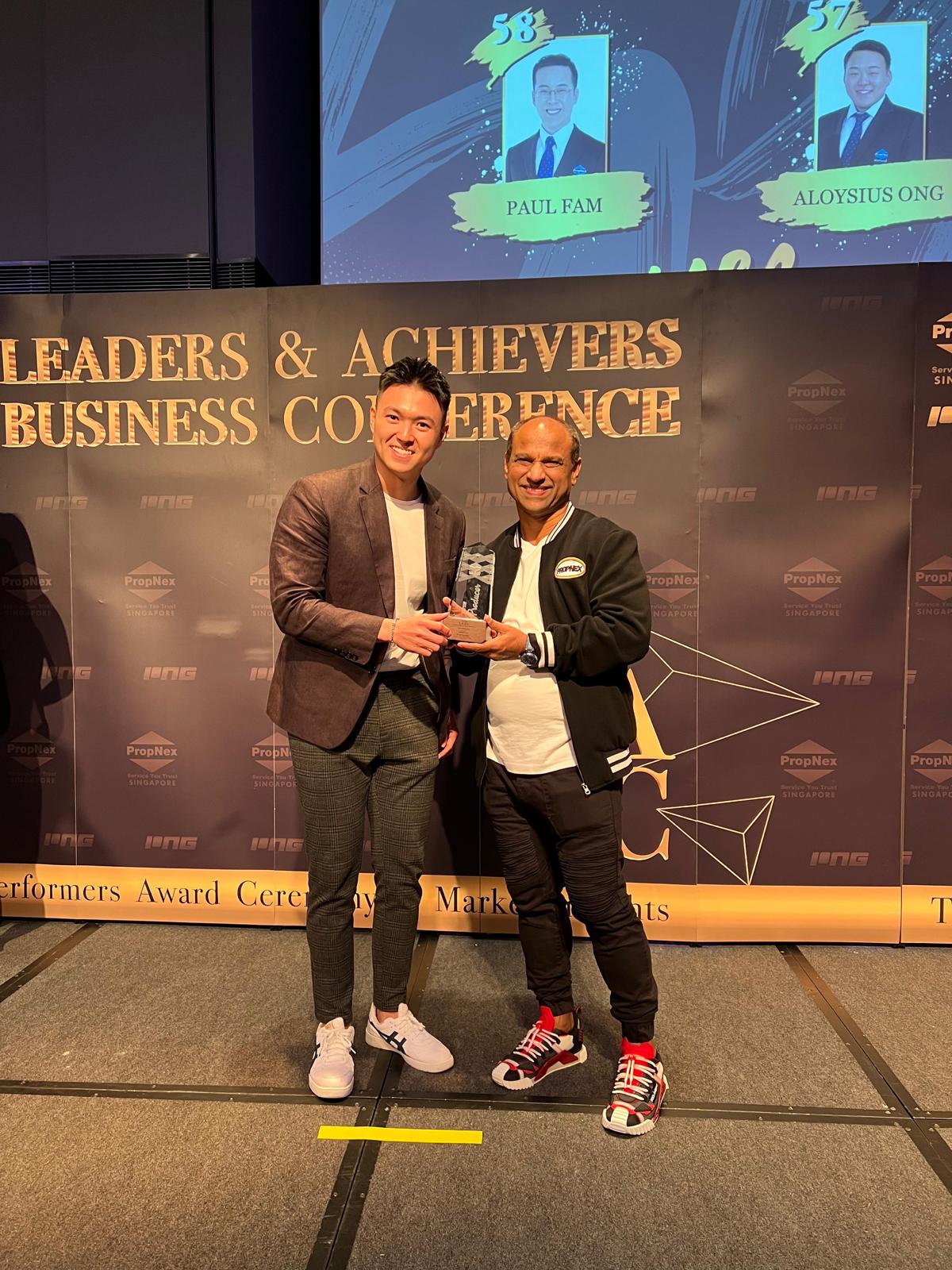 Damien Tan receiving an award at the PropNex Leaders & Achievers Business Conference